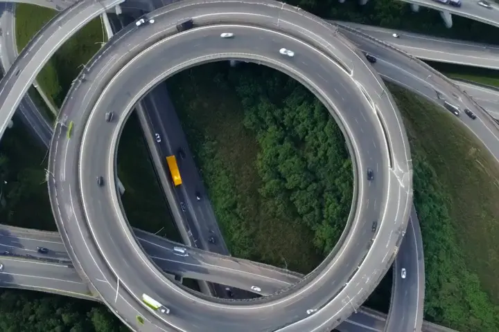 Circular highway interchange → Ice skating in circles on a frozen lake